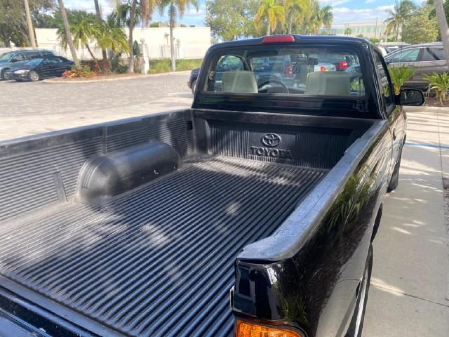 2002 Black Sand Pearl /Charcoal Toyota Tacoma 1 OWNER AUTO AC 4 CYL (5TENL42N02Z) with an 2.4L DOHC EFI 16-Valve I4 Engine engine, Automatic transmission, located at 4701 North Dixie Hwy, Pompano Beach, FL, 33064, (954) 422-2889, 26.240938, -80.123474 - OUR WEBPAGE FLORIDACARS1.COM HAS OVER 100 PHOTOS AND FREE CARFAX LINK 2002 TOYOTA TACOMA VIN: 5TENL42N02Z111289 5 T E N L 4 2 N 0 2 Z 1 1 1 2 8 9 PICKUP 2.4L I4 F DOHC GASOLINE 29 MPG REAR WHEEL DRIVE Features Air Conditioning AM/FM Stereo Automatic Transmission Bed Liner Cassette Player Cloth Seats - Photo#90