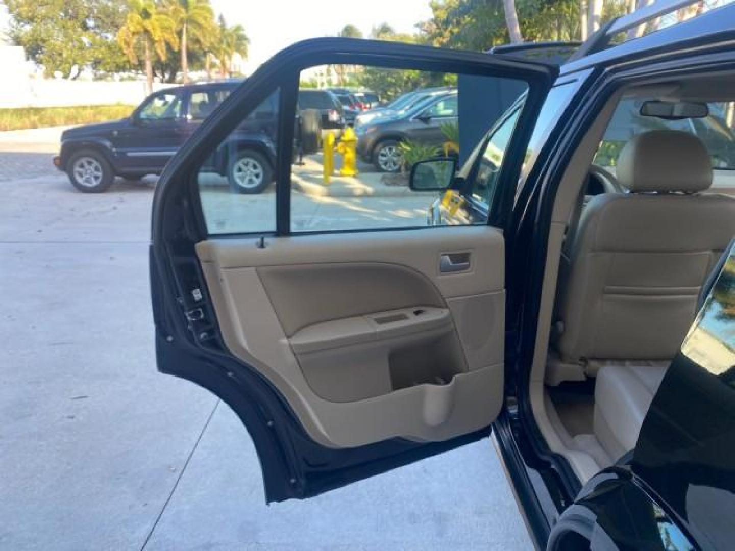 2005 Black /Pebble Ford Freestyle Limited LOW MILES 69,845 1 OWNER AWD (1FMZK06165G) with an 3.0L SMPI 24-Valve V6 Duratec Engine engine, Automatic transmission, located at 4701 North Dixie Hwy, Pompano Beach, FL, 33064, (954) 422-2889, 26.240938, -80.123474 - OUR WEBPAGE FLORIDACARS1.COM HAS OVER 100 PHOTOS AND FREE CARFAX LINK 2005 FORD FREESTYLE LIMITED VIN: 1FMZK06165GA49599 1 F M Z K 0 6 1 6 5 G A 4 9 5 9 9 4 DOOR WAGON/SPORT UTILITY 3.0L V6 F DOHC GASOLINE 24 MPG ALL WHEEL DRIVE Features 4WD/AWD ABS Brakes Air Conditioning Alloy Wheels AM/FM Stereo - Photo#13