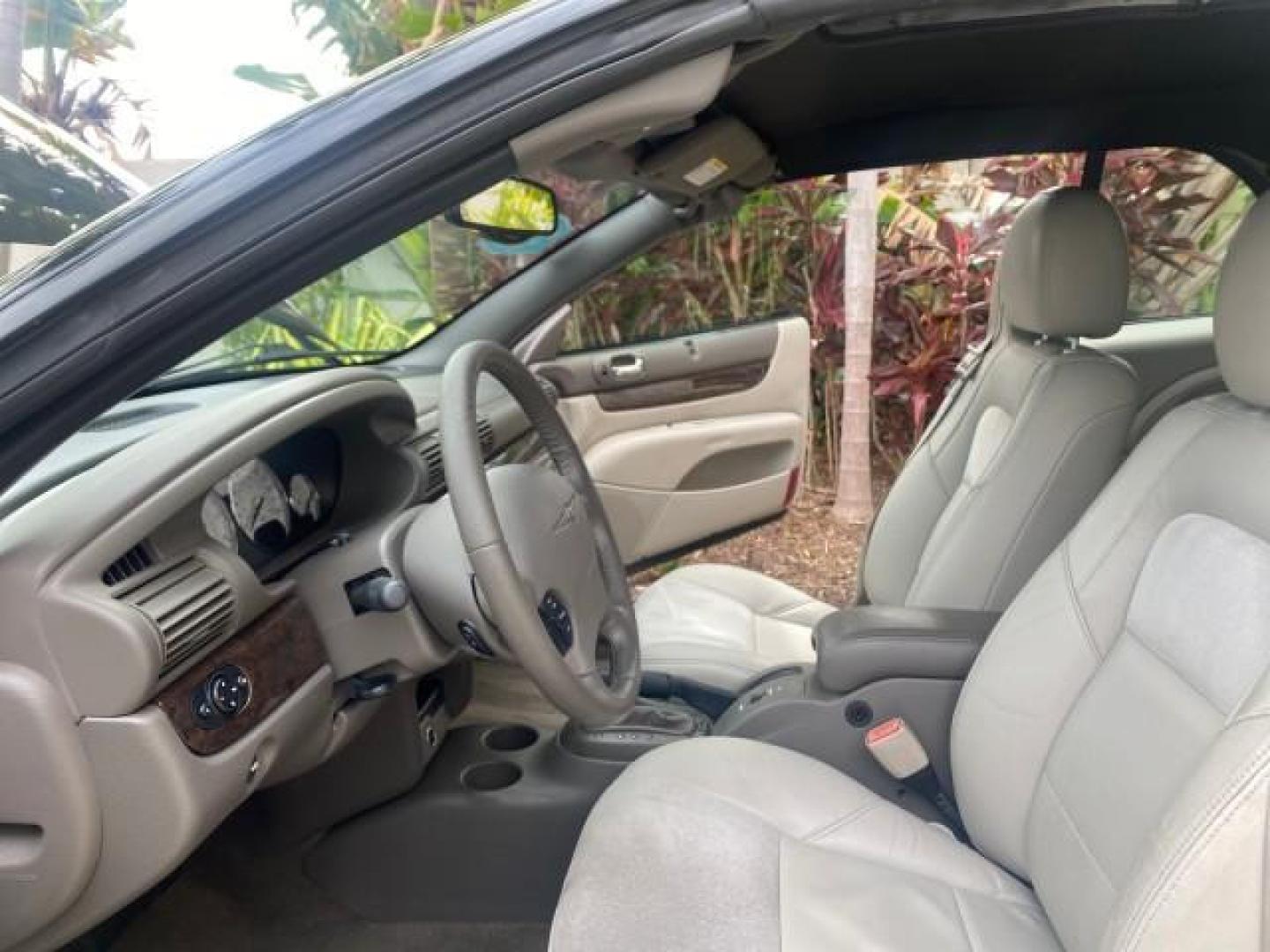 2004 Brilliant Black Crystal Prl /Dark Slate Gray Chrysler Sebring Limited LOW MILES 66,139 (1C3EL65R84N) with an 2.7L MPI DOHC 24-Valve V6 Engine engine, Automatic transmission, located at 4701 North Dixie Hwy, Pompano Beach, FL, 33064, (954) 422-2889, 26.240938, -80.123474 - OUR WEBPAGE FLORIDACARS1.COM HAS OVER 100 PHOTOS AND FREE CARFAX LINK 2004 CHRYSLER SEBRING LIMITED VIN: 1C3EL65R84N154413 1 C 3 E L 6 5 R 8 4 N 1 5 4 4 1 3 CONVERTIBLE 2.7L V6 F DOHC GASOLINE 28 MPG FRONT WHEEL DRIVE Features ABS Brakes Air Conditioning Alloy Wheels AM/FM Stereo Automatic Transmiss - Photo#10