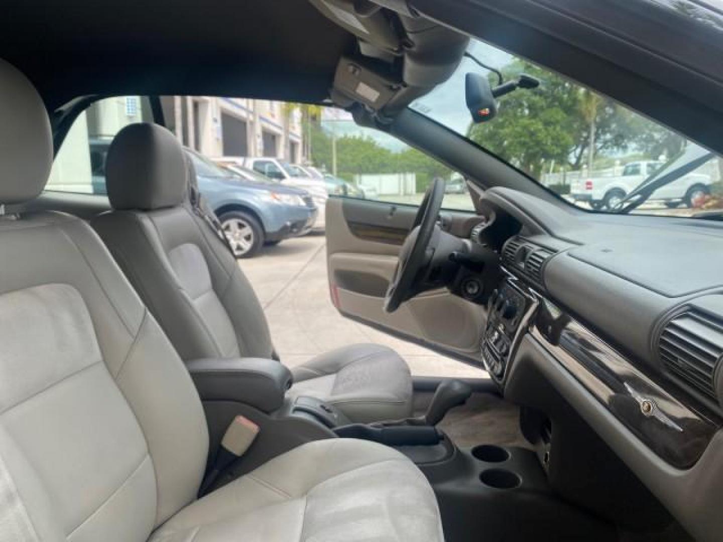 2004 Brilliant Black Crystal Prl /Dark Slate Gray Chrysler Sebring Limited LOW MILES 66,139 (1C3EL65R84N) with an 2.7L MPI DOHC 24-Valve V6 Engine engine, Automatic transmission, located at 4701 North Dixie Hwy, Pompano Beach, FL, 33064, (954) 422-2889, 26.240938, -80.123474 - OUR WEBPAGE FLORIDACARS1.COM HAS OVER 100 PHOTOS AND FREE CARFAX LINK 2004 CHRYSLER SEBRING LIMITED VIN: 1C3EL65R84N154413 1 C 3 E L 6 5 R 8 4 N 1 5 4 4 1 3 CONVERTIBLE 2.7L V6 F DOHC GASOLINE 28 MPG FRONT WHEEL DRIVE Features ABS Brakes Air Conditioning Alloy Wheels AM/FM Stereo Automatic Transmiss - Photo#12