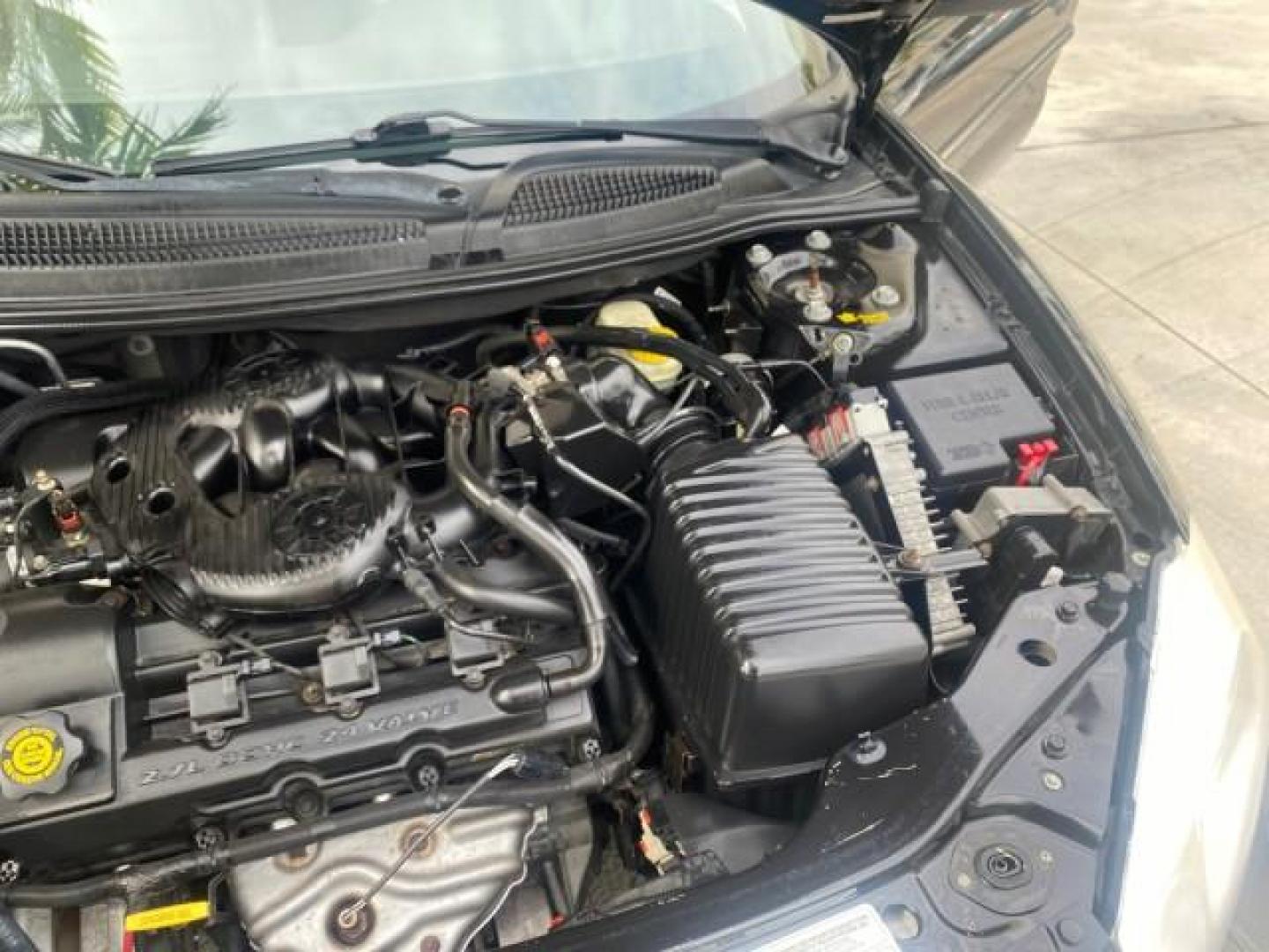 2004 Brilliant Black Crystal Prl /Dark Slate Gray Chrysler Sebring Limited LOW MILES 66,139 (1C3EL65R84N) with an 2.7L MPI DOHC 24-Valve V6 Engine engine, Automatic transmission, located at 4701 North Dixie Hwy, Pompano Beach, FL, 33064, (954) 422-2889, 26.240938, -80.123474 - OUR WEBPAGE FLORIDACARS1.COM HAS OVER 100 PHOTOS AND FREE CARFAX LINK 2004 CHRYSLER SEBRING LIMITED VIN: 1C3EL65R84N154413 1 C 3 E L 6 5 R 8 4 N 1 5 4 4 1 3 CONVERTIBLE 2.7L V6 F DOHC GASOLINE 28 MPG FRONT WHEEL DRIVE Features ABS Brakes Air Conditioning Alloy Wheels AM/FM Stereo Automatic Transmiss - Photo#26