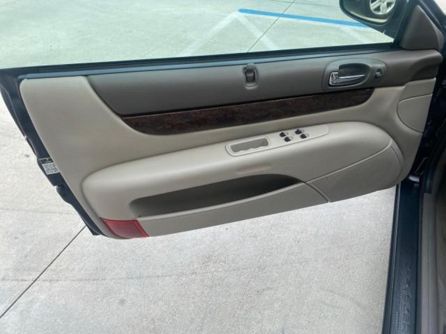 2004 Brilliant Black Crystal Prl /Dark Slate Gray Chrysler Sebring Limited LOW MILES 66,139 (1C3EL65R84N) with an 2.7L MPI DOHC 24-Valve V6 Engine engine, Automatic transmission, located at 4701 North Dixie Hwy, Pompano Beach, FL, 33064, (954) 422-2889, 26.240938, -80.123474 - OUR WEBPAGE FLORIDACARS1.COM HAS OVER 100 PHOTOS AND FREE CARFAX LINK 2004 CHRYSLER SEBRING LIMITED VIN: 1C3EL65R84N154413 1 C 3 E L 6 5 R 8 4 N 1 5 4 4 1 3 CONVERTIBLE 2.7L V6 F DOHC GASOLINE 28 MPG FRONT WHEEL DRIVE Features ABS Brakes Air Conditioning Alloy Wheels AM/FM Stereo Automatic Transmiss - Photo#63