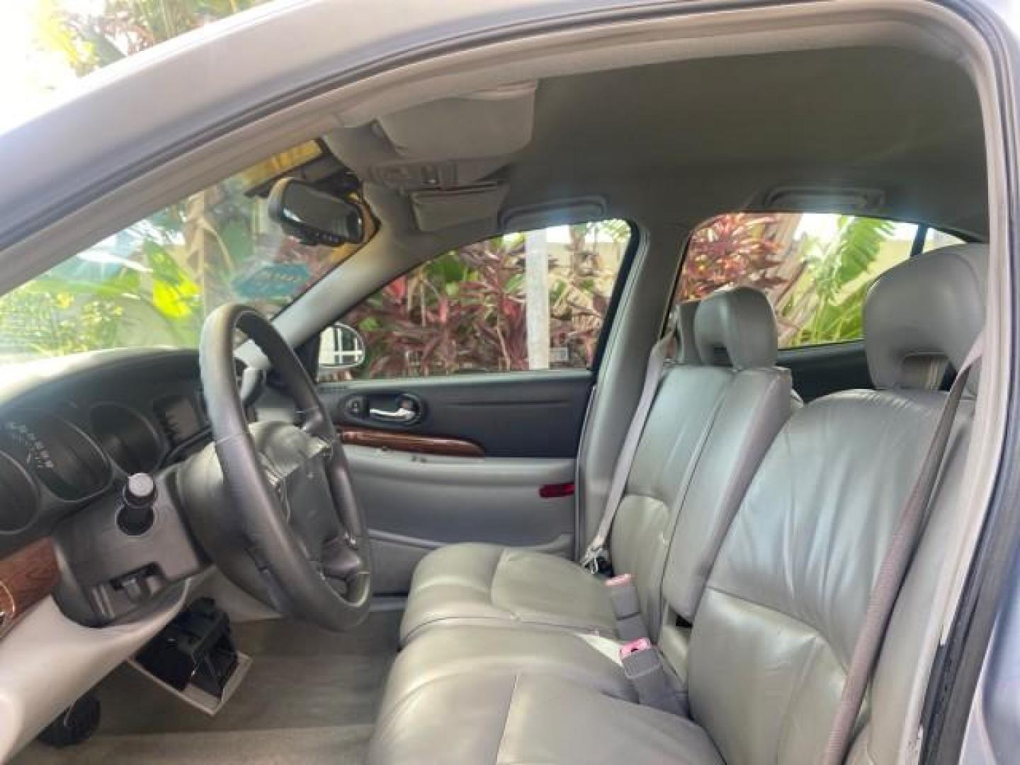 2005 Ming Blue Metallic /Gray Buick LeSabre LEATHER LOW MILES 62,243 (1G4HP54KX5U) with an 3.8L 3800 V6 SFI Engine engine, Automatic transmission, located at 4701 North Dixie Hwy, Pompano Beach, FL, 33064, (954) 422-2889, 26.240938, -80.123474 - OUR WEBPAGE FLORIDACARS1.COM HAS OVER 100 PHOTOS AND FREE CARFAX LINK 2005 BUICK LESABRE LEATHER LOADED RUNS LIKE NEW VIN: 1G4HP54KX5U177562 1 G 4 H P 5 4 K X 5 U 1 7 7 5 6 2 SEDAN 4 DR 3.8L V6 F OHV GASOLINE 29 MPG FRONT WHEEL DRIVE Features ABS Brakes Air Conditioning Alloy Wheels AM/FM Stereo Aut - Photo#46