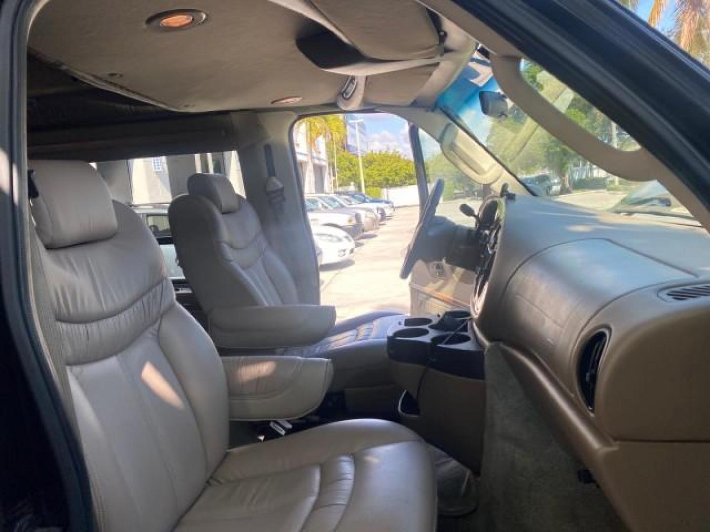 2006 Black /Medium Pebble Ford Econoline HI TOP E250 EXPLORER CONVERSION HANDICAP (1FDNE24L26H) with an 5.4L SOHC EFI V8 Triton Engine engine, Automatic transmission, located at 4701 North Dixie Hwy, Pompano Beach, FL, 33064, (954) 422-2889, 26.240938, -80.123474 - OUR WEBPAGE FLORIDACARS1.COM HAS OVER 100 PHOTOS AND FREE CARFAX LINK 2006 FORD ECONOLINE E250 EXPLORER CONVERSION HANDICAP $90,000 NEW VIN: 1FDNE24L26HA32770 1 F D N E 2 4 L 2 6 H A 3 2 7 7 0 VAN 5.4L V8 F GASOLINE REAR WHEEL DRIVE Features ABS Brakes Air Conditioning Alloy Wheels AM/FM Stereo Auto - Photo#12