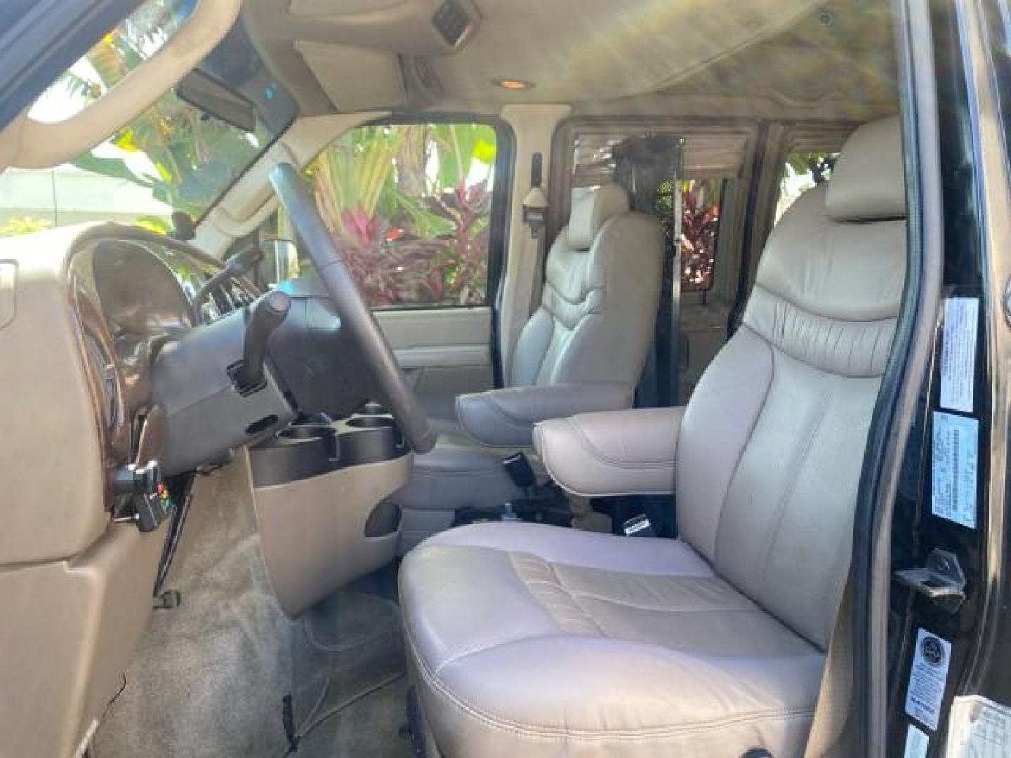 2006 Black /Medium Pebble Ford Econoline HI TOP E250 EXPLORER CONVERSION HANDICAP (1FDNE24L26H) with an 5.4L SOHC EFI V8 Triton Engine engine, Automatic transmission, located at 4701 North Dixie Hwy, Pompano Beach, FL, 33064, (954) 422-2889, 26.240938, -80.123474 - OUR WEBPAGE FLORIDACARS1.COM HAS OVER 100 PHOTOS AND FREE CARFAX LINK 2006 FORD ECONOLINE E250 EXPLORER CONVERSION HANDICAP $90,000 NEW VIN: 1FDNE24L26HA32770 1 F D N E 2 4 L 2 6 H A 3 2 7 7 0 VAN 5.4L V8 F GASOLINE REAR WHEEL DRIVE Features ABS Brakes Air Conditioning Alloy Wheels AM/FM Stereo Auto - Photo#44