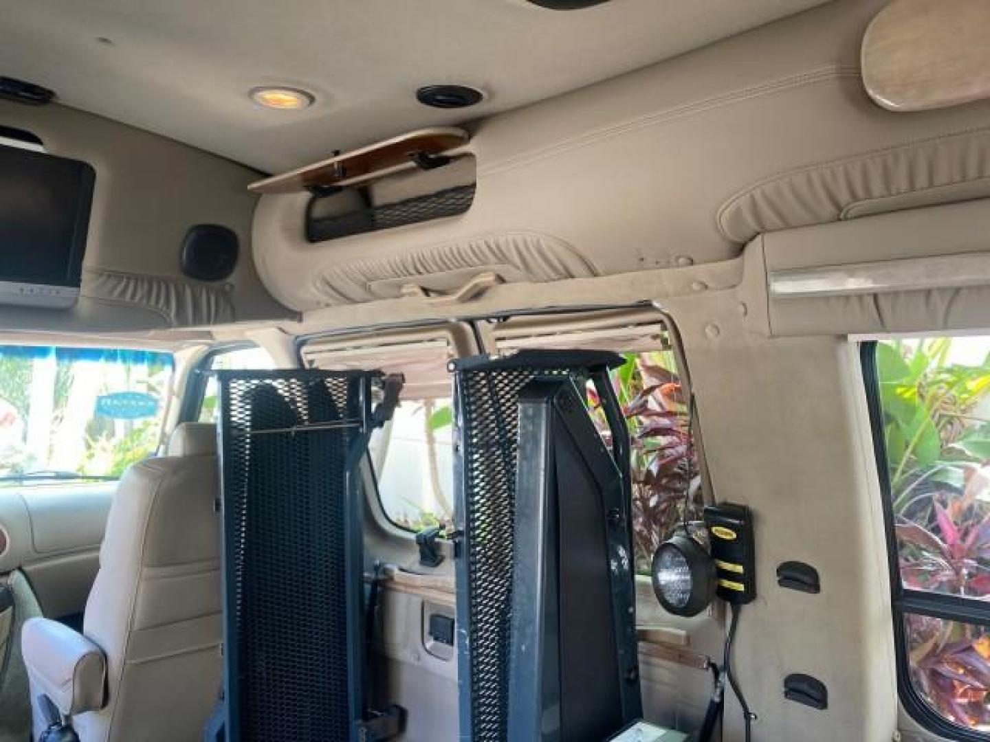 2006 Black /Medium Pebble Ford Econoline HI TOP E250 EXPLORER CONVERSION HANDICAP (1FDNE24L26H) with an 5.4L SOHC EFI V8 Triton Engine engine, Automatic transmission, located at 4701 North Dixie Hwy, Pompano Beach, FL, 33064, (954) 422-2889, 26.240938, -80.123474 - OUR WEBPAGE FLORIDACARS1.COM HAS OVER 100 PHOTOS AND FREE CARFAX LINK 2006 FORD ECONOLINE E250 EXPLORER CONVERSION HANDICAP $90,000 NEW VIN: 1FDNE24L26HA32770 1 F D N E 2 4 L 2 6 H A 3 2 7 7 0 VAN 5.4L V8 F GASOLINE REAR WHEEL DRIVE Features ABS Brakes Air Conditioning Alloy Wheels AM/FM Stereo Auto - Photo#81