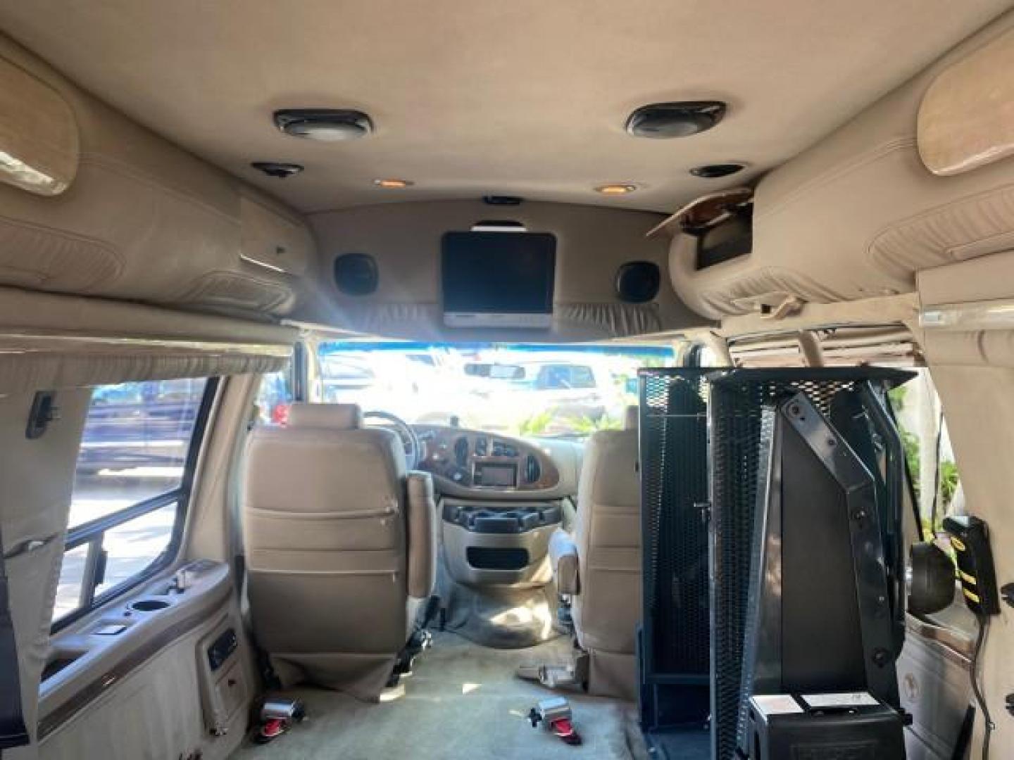 2006 Black /Medium Pebble Ford Econoline HI TOP E250 EXPLORER CONVERSION HANDICAP (1FDNE24L26H) with an 5.4L SOHC EFI V8 Triton Engine engine, Automatic transmission, located at 4701 North Dixie Hwy, Pompano Beach, FL, 33064, (954) 422-2889, 26.240938, -80.123474 - OUR WEBPAGE FLORIDACARS1.COM HAS OVER 100 PHOTOS AND FREE CARFAX LINK 2006 FORD ECONOLINE E250 EXPLORER CONVERSION HANDICAP $90,000 NEW VIN: 1FDNE24L26HA32770 1 F D N E 2 4 L 2 6 H A 3 2 7 7 0 VAN 5.4L V8 F GASOLINE REAR WHEEL DRIVE Features ABS Brakes Air Conditioning Alloy Wheels AM/FM Stereo Auto - Photo#96