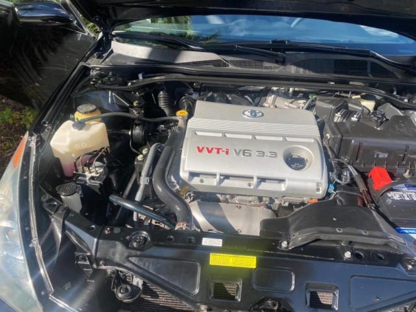 2006 Black /Dark Stone Toyota Camry Solara SE V6 CONV LOW MILES 57,572 (4T1FA38P16U) with an 3.3L DOHC SMPI 24-Valve V6 Engine engine, Automatic transmission, located at 4701 North Dixie Hwy, Pompano Beach, FL, 33064, (954) 422-2889, 26.240938, -80.123474 - OUR WEBPAGE FLORIDACARS1.COM HAS OVER 100 PHOTOS AND FREE CARFAX LINK 2006 TOYOTA CAMRY SOLARA SE V6 VIN: 4T1FA38P16U086295 4 T 1 F A 3 8 P 1 6 U 0 8 6 2 9 5 CONVERTIBLE 3.3L V6 F DOHC 24V GASOLINE 29 MPG FRONT WHEEL DRIVE Features ABS Brakes Air Conditioning Alloy Wheels AM/FM Stereo Automatic Tran - Photo#25