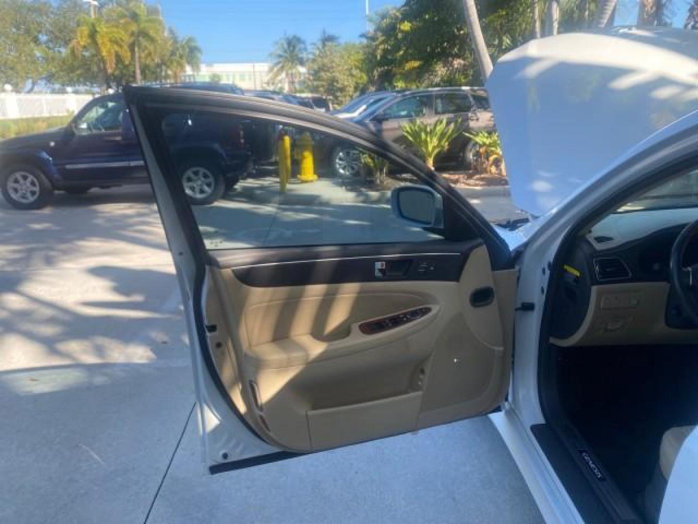 2012 White Satin Pearl /Saddle Hyundai Genesis 4.6L V8 LOW MILES PEARL WHITE (KMHGC4DF6CU) with an 4.6L DOHC MPI 32-Valve V8 Engine engine, Automatic transmission, located at 4701 North Dixie Hwy, Pompano Beach, FL, 33064, (954) 422-2889, 26.240938, -80.123474 - OUR WEBPAGE FLORIDACARS1.COM HAS OVER 100 PHOTOS AND FREE CARFAX LINK 2012 HYUNDAI GENESIS 4.6L V8 THIS CAR IS LOADED WITH EVERY OPTION POSSIBLE NEW $44,500 VIN: KMHGC4DF6CU166625 K M H G C 4 D F 6 C U 1 6 6 6 2 5 SEDAN 4 DR 4.6L V8 F DOHC 32V GASOLINE 25 MPG REAR WHEEL DRIVE Features A/C Seat(s) AB - Photo#9