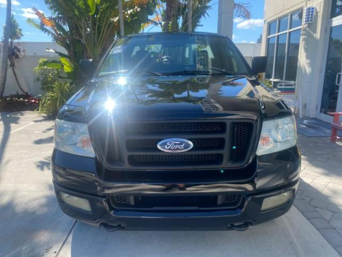 2004 Black /Flint Ford F-150 STX LOW MILES 46,755 4WD (1FTRF14W54N) with an 4.6L EFI V8 Engine engine, Automatic transmission, located at 4701 North Dixie Hwy, Pompano Beach, FL, 33064, (954) 422-2889, 26.240938, -80.123474 - OUR WEBPAGE FLORIDACARS1.COM HAS OVER 100 PHOTOS AND FREE CARFAX LINK 2004 FORD F-150 STX 4WD WE HAVE THE LOWEST MILEAGE ONE FOR SALE IN THE COUNTRY 46,755 VIN: 1FTRF14W54NB29502 1 F T R F 1 4 W 5 4 N B 2 9 5 0 2 PICKUP 4.6L V8 F SOHC 16V GASOLINE 18 MPG REAR WHEEL DRIVE W/ 4X4 Features 4WD/AWD ABS - Photo#2
