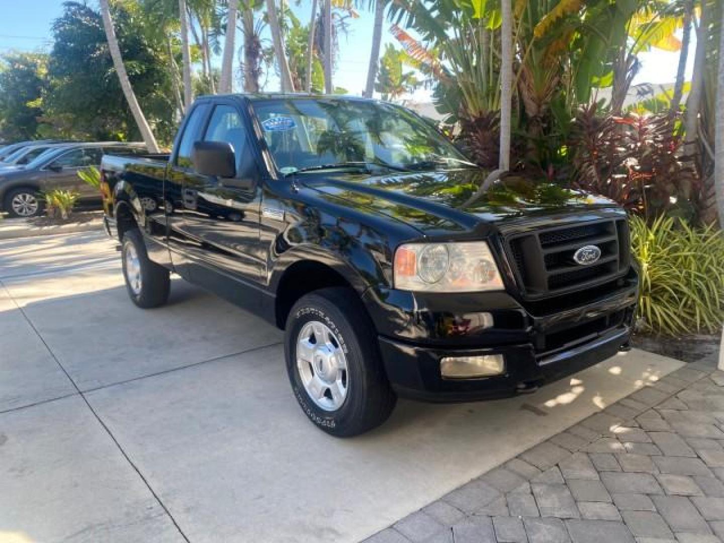 2004 Black /Flint Ford F-150 STX LOW MILES 46,755 4WD (1FTRF14W54N) with an 4.6L EFI V8 Engine engine, Automatic transmission, located at 4701 North Dixie Hwy, Pompano Beach, FL, 33064, (954) 422-2889, 26.240938, -80.123474 - OUR WEBPAGE FLORIDACARS1.COM HAS OVER 100 PHOTOS AND FREE CARFAX LINK 2004 FORD F-150 STX 4WD WE HAVE THE LOWEST MILEAGE ONE FOR SALE IN THE COUNTRY 46,755 VIN: 1FTRF14W54NB29502 1 F T R F 1 4 W 5 4 N B 2 9 5 0 2 PICKUP 4.6L V8 F SOHC 16V GASOLINE 18 MPG REAR WHEEL DRIVE W/ 4X4 Features 4WD/AWD ABS - Photo#7