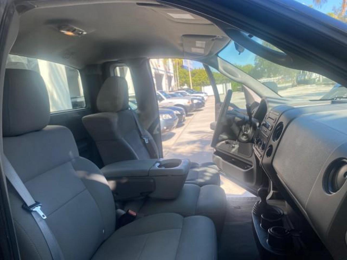 2004 Black /Flint Ford F-150 STX LOW MILES 46,755 4WD (1FTRF14W54N) with an 4.6L EFI V8 Engine engine, Automatic transmission, located at 4701 North Dixie Hwy, Pompano Beach, FL, 33064, (954) 422-2889, 26.240938, -80.123474 - OUR WEBPAGE FLORIDACARS1.COM HAS OVER 100 PHOTOS AND FREE CARFAX LINK 2004 FORD F-150 STX 4WD WE HAVE THE LOWEST MILEAGE ONE FOR SALE IN THE COUNTRY 46,755 VIN: 1FTRF14W54NB29502 1 F T R F 1 4 W 5 4 N B 2 9 5 0 2 PICKUP 4.6L V8 F SOHC 16V GASOLINE 18 MPG REAR WHEEL DRIVE W/ 4X4 Features 4WD/AWD ABS - Photo#12