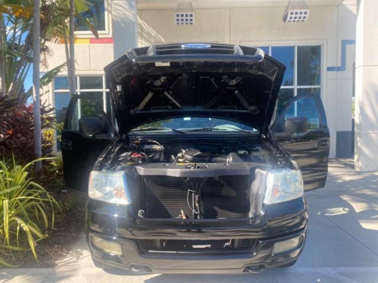 2004 Black /Flint Ford F-150 STX LOW MILES 46,755 4WD (1FTRF14W54N) with an 4.6L EFI V8 Engine engine, Automatic transmission, located at 4701 North Dixie Hwy, Pompano Beach, FL, 33064, (954) 422-2889, 26.240938, -80.123474 - OUR WEBPAGE FLORIDACARS1.COM HAS OVER 100 PHOTOS AND FREE CARFAX LINK 2004 FORD F-150 STX 4WD WE HAVE THE LOWEST MILEAGE ONE FOR SALE IN THE COUNTRY 46,755 VIN: 1FTRF14W54NB29502 1 F T R F 1 4 W 5 4 N B 2 9 5 0 2 PICKUP 4.6L V8 F SOHC 16V GASOLINE 18 MPG REAR WHEEL DRIVE W/ 4X4 Features 4WD/AWD ABS - Photo#17