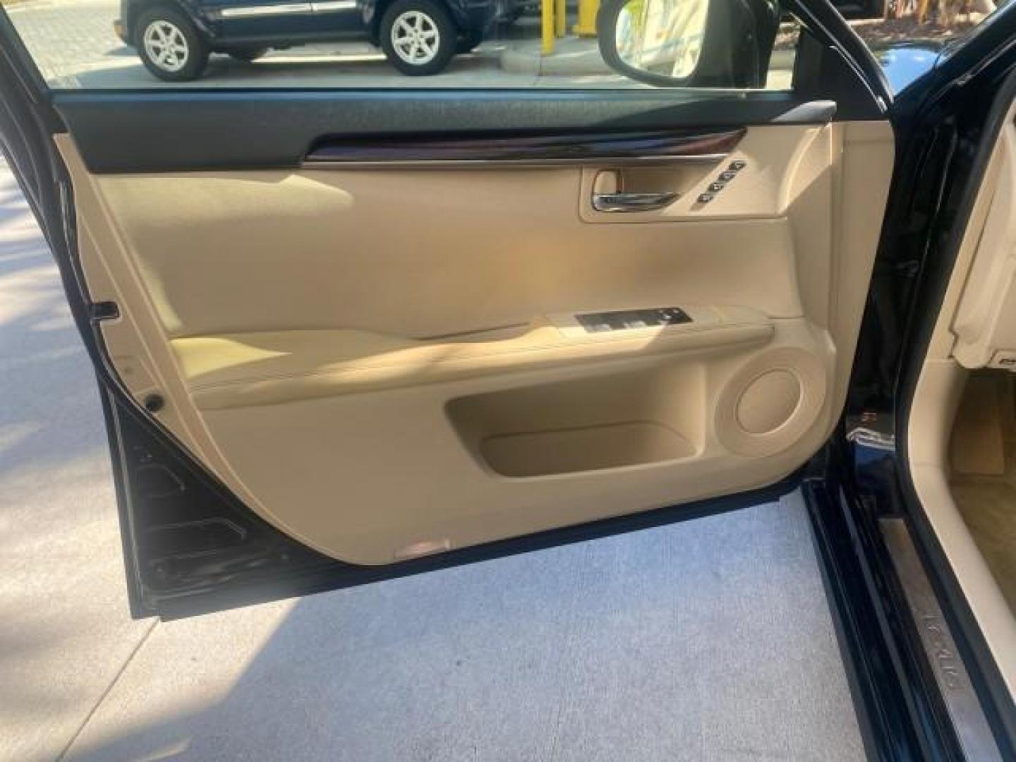 2013 Obsidian /Parchment Lexus ES 350 4dr Sdn LOW MILES 17,959 1 OWNER (JTHBK1GGXD2) with an 3.5L DOHC SFI 24-Valve V6 Engine engine, Automatic transmission, located at 4701 North Dixie Hwy, Pompano Beach, FL, 33064, (954) 422-2889, 26.240938, -80.123474 - OUR WEBPAGE FLORIDACARS1.COM HAS OVER 100 PHOTOS AND FREE CARFAX LINK 2013 LEXUS ES 350 - THIS IS THE LOWEST MILEAGE ONE IN THE COUNTRY FOR SALE 17,959 VIN: JTHBK1GGXD2003380 J T H B K 1 G G X D 2 0 0 3 3 8 0 SEDAN 4 DR 3.5L V6 F DOHC 24V GASOLINE 31 MPG FRONT WHEEL DRIVE Features A/C Seat(s) ABS Br - Photo#40