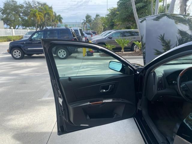 2004 Black Raven /Ebony Cadillac CTS LOW MILES 59,491 SUNROOF (1G6DM577140) with an 3.6L V6 VVT Engine engine, Automatic transmission, located at 4701 North Dixie Hwy, Pompano Beach, FL, 33064, (954) 422-2889, 26.240938, -80.123474 - OUR WEBPAGE FLORIDACARS1.COM HAS OVER 100 PHOTOS AND FREE CARFAX LINK 2004 CADILLAC CTS VIN: 1G6DM577140165313 1 G 6 D M 5 7 7 1 4 0 1 6 5 3 1 3 SEDAN 4 DR 3.6L V6 F GASOLINE 26 MPG REAR WHEEL DRIVE Features ABS Brakes Air Conditioning Alloy Wheels AM/FM Stereo Automatic Transmission CD Audio Cruise - Photo#9