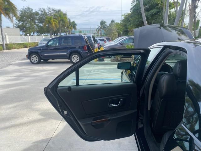 2004 Black Raven /Ebony Cadillac CTS LOW MILES 59,491 SUNROOF (1G6DM577140) with an 3.6L V6 VVT Engine engine, Automatic transmission, located at 4701 North Dixie Hwy, Pompano Beach, FL, 33064, (954) 422-2889, 26.240938, -80.123474 - OUR WEBPAGE FLORIDACARS1.COM HAS OVER 100 PHOTOS AND FREE CARFAX LINK 2004 CADILLAC CTS VIN: 1G6DM577140165313 1 G 6 D M 5 7 7 1 4 0 1 6 5 3 1 3 SEDAN 4 DR 3.6L V6 F GASOLINE 26 MPG REAR WHEEL DRIVE Features ABS Brakes Air Conditioning Alloy Wheels AM/FM Stereo Automatic Transmission CD Audio Cruise - Photo#13