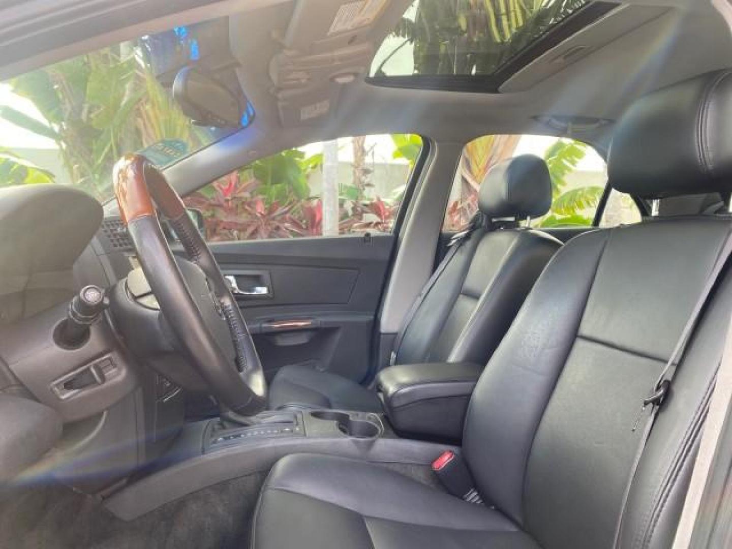 2004 Black Raven /Ebony Cadillac CTS LOW MILES 59,491 SUNROOF (1G6DM577140) with an 3.6L V6 VVT Engine engine, Automatic transmission, located at 4701 North Dixie Hwy, Pompano Beach, FL, 33064, (954) 422-2889, 26.240938, -80.123474 - OUR WEBPAGE FLORIDACARS1.COM HAS OVER 100 PHOTOS AND FREE CARFAX LINK 2004 CADILLAC CTS VIN: 1G6DM577140165313 1 G 6 D M 5 7 7 1 4 0 1 6 5 3 1 3 SEDAN 4 DR 3.6L V6 F GASOLINE 26 MPG REAR WHEEL DRIVE Features ABS Brakes Air Conditioning Alloy Wheels AM/FM Stereo Automatic Transmission CD Audio Cruise - Photo#45