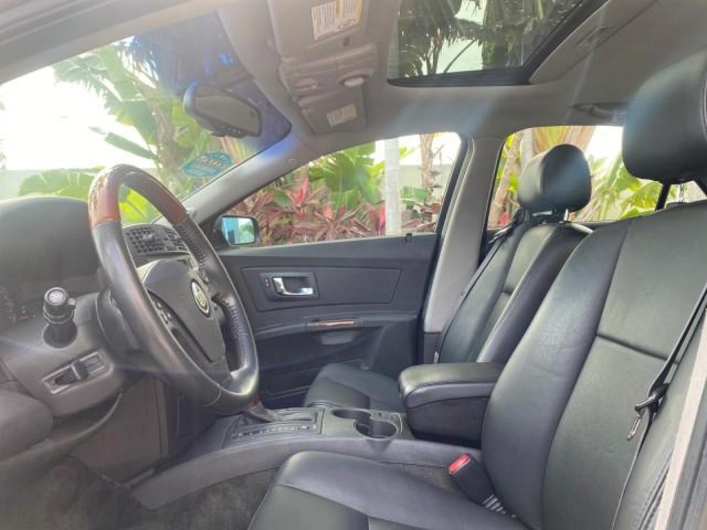 2004 Black Raven /Ebony Cadillac CTS LOW MILES 59,491 SUNROOF (1G6DM577140) with an 3.6L V6 VVT Engine engine, Automatic transmission, located at 4701 North Dixie Hwy, Pompano Beach, FL, 33064, (954) 422-2889, 26.240938, -80.123474 - OUR WEBPAGE FLORIDACARS1.COM HAS OVER 100 PHOTOS AND FREE CARFAX LINK 2004 CADILLAC CTS VIN: 1G6DM577140165313 1 G 6 D M 5 7 7 1 4 0 1 6 5 3 1 3 SEDAN 4 DR 3.6L V6 F GASOLINE 26 MPG REAR WHEEL DRIVE Features ABS Brakes Air Conditioning Alloy Wheels AM/FM Stereo Automatic Transmission CD Audio Cruise - Photo#46