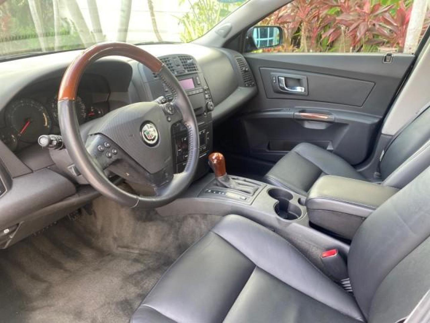 2004 Black Raven /Ebony Cadillac CTS LOW MILES 59,491 SUNROOF (1G6DM577140) with an 3.6L V6 VVT Engine engine, Automatic transmission, located at 4701 North Dixie Hwy, Pompano Beach, FL, 33064, (954) 422-2889, 26.240938, -80.123474 - OUR WEBPAGE FLORIDACARS1.COM HAS OVER 100 PHOTOS AND FREE CARFAX LINK 2004 CADILLAC CTS VIN: 1G6DM577140165313 1 G 6 D M 5 7 7 1 4 0 1 6 5 3 1 3 SEDAN 4 DR 3.6L V6 F GASOLINE 26 MPG REAR WHEEL DRIVE Features ABS Brakes Air Conditioning Alloy Wheels AM/FM Stereo Automatic Transmission CD Audio Cruise - Photo#47