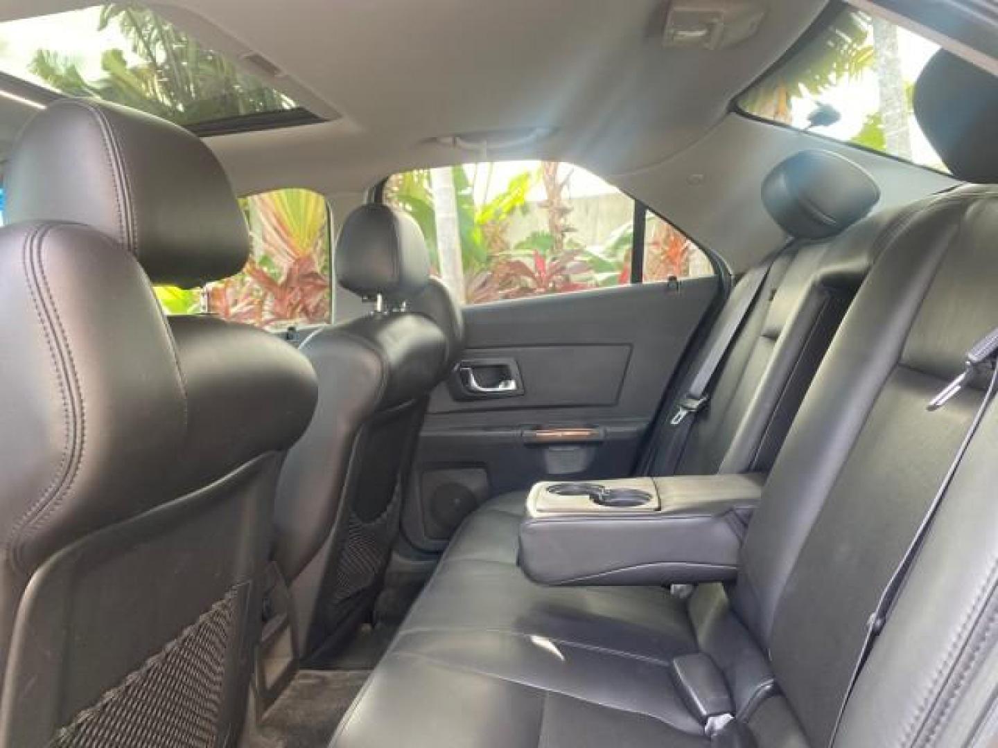 2004 Black Raven /Ebony Cadillac CTS LOW MILES 59,491 SUNROOF (1G6DM577140) with an 3.6L V6 VVT Engine engine, Automatic transmission, located at 4701 North Dixie Hwy, Pompano Beach, FL, 33064, (954) 422-2889, 26.240938, -80.123474 - OUR WEBPAGE FLORIDACARS1.COM HAS OVER 100 PHOTOS AND FREE CARFAX LINK 2004 CADILLAC CTS VIN: 1G6DM577140165313 1 G 6 D M 5 7 7 1 4 0 1 6 5 3 1 3 SEDAN 4 DR 3.6L V6 F GASOLINE 26 MPG REAR WHEEL DRIVE Features ABS Brakes Air Conditioning Alloy Wheels AM/FM Stereo Automatic Transmission CD Audio Cruise - Photo#81