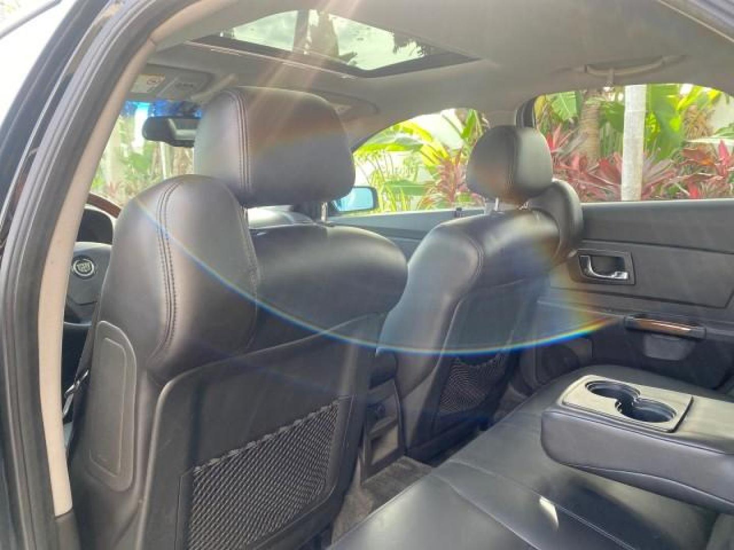 2004 Black Raven /Ebony Cadillac CTS LOW MILES 59,491 SUNROOF (1G6DM577140) with an 3.6L V6 VVT Engine engine, Automatic transmission, located at 4701 North Dixie Hwy, Pompano Beach, FL, 33064, (954) 422-2889, 26.240938, -80.123474 - OUR WEBPAGE FLORIDACARS1.COM HAS OVER 100 PHOTOS AND FREE CARFAX LINK 2004 CADILLAC CTS VIN: 1G6DM577140165313 1 G 6 D M 5 7 7 1 4 0 1 6 5 3 1 3 SEDAN 4 DR 3.6L V6 F GASOLINE 26 MPG REAR WHEEL DRIVE Features ABS Brakes Air Conditioning Alloy Wheels AM/FM Stereo Automatic Transmission CD Audio Cruise - Photo#83