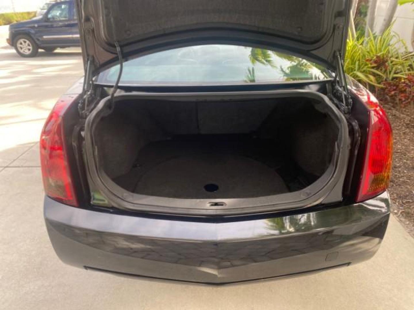 2004 Black Raven /Ebony Cadillac CTS LOW MILES 59,491 SUNROOF (1G6DM577140) with an 3.6L V6 VVT Engine engine, Automatic transmission, located at 4701 North Dixie Hwy, Pompano Beach, FL, 33064, (954) 422-2889, 26.240938, -80.123474 - OUR WEBPAGE FLORIDACARS1.COM HAS OVER 100 PHOTOS AND FREE CARFAX LINK 2004 CADILLAC CTS VIN: 1G6DM577140165313 1 G 6 D M 5 7 7 1 4 0 1 6 5 3 1 3 SEDAN 4 DR 3.6L V6 F GASOLINE 26 MPG REAR WHEEL DRIVE Features ABS Brakes Air Conditioning Alloy Wheels AM/FM Stereo Automatic Transmission CD Audio Cruise - Photo#98