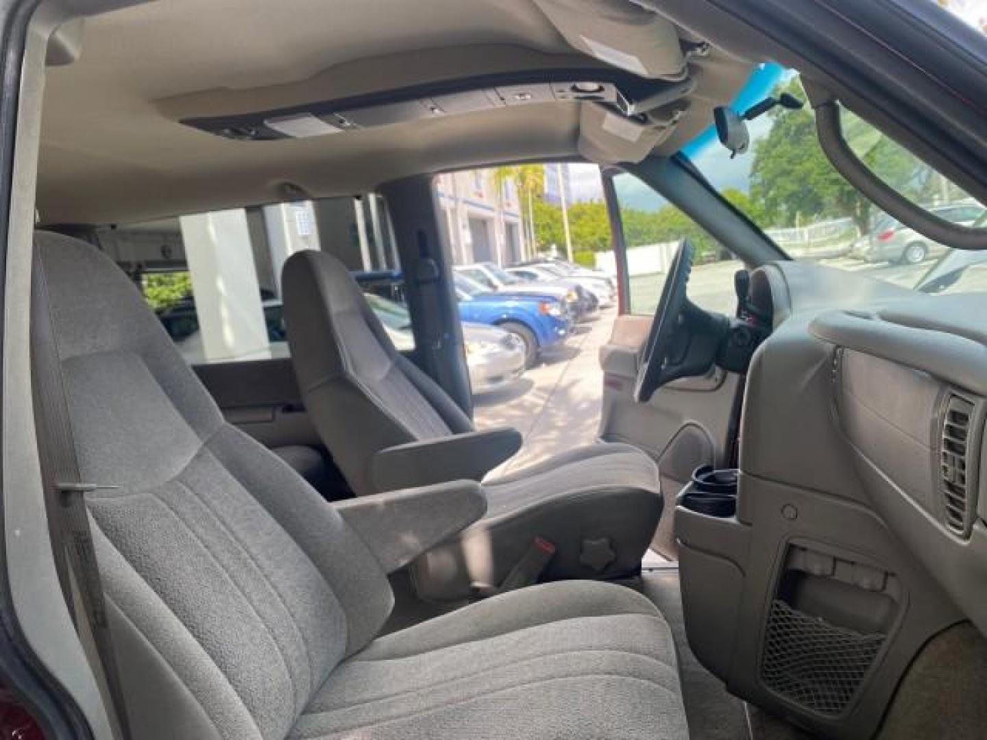 2003 Dark Toreador Red Metallic /Pewter GMC Safari Passenger LOW MILES 34,284 1 OWNER 8 PASSENGER (1GKEL19X13B) with an 4.3L Vortec 4300 V6 MFI Engine engine, Automatic transmission, located at 4701 North Dixie Hwy, Pompano Beach, FL, 33064, (954) 422-2889, 26.240938, -80.123474 - OUR WEBPAGE FLORIDACARS1.COM HAS OVER 100 PHOTOS AND FREE CARFAX LINK 2003 GMC SAFARI 8 PASSENGER AWD 1 OWNER SINCE NEW - ONE OF A KIND FIND VIN: 1GKEL19X13B516237 1 G K E L 1 9 X 1 3 B 5 1 6 2 3 7 VAN 4.3L V6 F OHV 12V GASOLINE 18 MPG ALL WHEEL DRIVE Features 4WD/AWD ABS Brakes Air Conditioning All - Photo#12