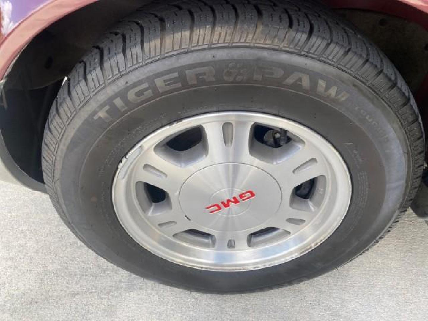 2003 Dark Toreador Red Metallic /Pewter GMC Safari Passenger LOW MILES 34,284 1 OWNER 8 PASSENGER (1GKEL19X13B) with an 4.3L Vortec 4300 V6 MFI Engine engine, Automatic transmission, located at 4701 North Dixie Hwy, Pompano Beach, FL, 33064, (954) 422-2889, 26.240938, -80.123474 - OUR WEBPAGE FLORIDACARS1.COM HAS OVER 100 PHOTOS AND FREE CARFAX LINK 2003 GMC SAFARI 8 PASSENGER AWD 1 OWNER SINCE NEW - ONE OF A KIND FIND VIN: 1GKEL19X13B516237 1 G K E L 1 9 X 1 3 B 5 1 6 2 3 7 VAN 4.3L V6 F OHV 12V GASOLINE 18 MPG ALL WHEEL DRIVE Features 4WD/AWD ABS Brakes Air Conditioning All - Photo#19