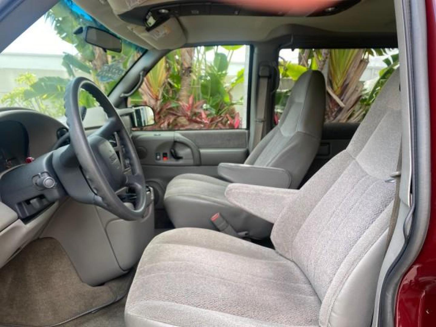 2003 Dark Toreador Red Metallic /Pewter GMC Safari Passenger LOW MILES 34,284 1 OWNER 8 PASSENGER (1GKEL19X13B) with an 4.3L Vortec 4300 V6 MFI Engine engine, Automatic transmission, located at 4701 North Dixie Hwy, Pompano Beach, FL, 33064, (954) 422-2889, 26.240938, -80.123474 - OUR WEBPAGE FLORIDACARS1.COM HAS OVER 100 PHOTOS AND FREE CARFAX LINK 2003 GMC SAFARI 8 PASSENGER AWD 1 OWNER SINCE NEW - ONE OF A KIND FIND VIN: 1GKEL19X13B516237 1 G K E L 1 9 X 1 3 B 5 1 6 2 3 7 VAN 4.3L V6 F OHV 12V GASOLINE 18 MPG ALL WHEEL DRIVE Features 4WD/AWD ABS Brakes Air Conditioning All - Photo#45