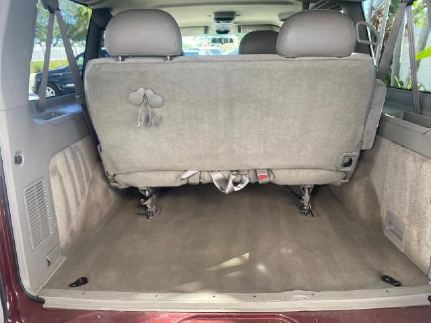 2003 Dark Toreador Red Metallic /Pewter GMC Safari Passenger LOW MILES 34,284 1 OWNER 8 PASSENGER (1GKEL19X13B) with an 4.3L Vortec 4300 V6 MFI Engine engine, Automatic transmission, located at 4701 North Dixie Hwy, Pompano Beach, FL, 33064, (954) 422-2889, 26.240938, -80.123474 - OUR WEBPAGE FLORIDACARS1.COM HAS OVER 100 PHOTOS AND FREE CARFAX LINK 2003 GMC SAFARI 8 PASSENGER AWD 1 OWNER SINCE NEW - ONE OF A KIND FIND VIN: 1GKEL19X13B516237 1 G K E L 1 9 X 1 3 B 5 1 6 2 3 7 VAN 4.3L V6 F OHV 12V GASOLINE 18 MPG ALL WHEEL DRIVE Features 4WD/AWD ABS Brakes Air Conditioning All - Photo#88