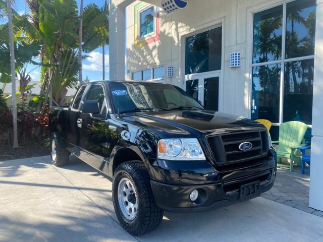 2006 Black /Flint Ford F-150 STX 4 DOOR LOW MILES 92,223 (1FTRX12W56N) with an 4.6L EFI V8 Engine engine, Automatic transmission, located at 4701 North Dixie Hwy, Pompano Beach, FL, 33064, (954) 422-2889, 26.240938, -80.123474 - OUR WEBPAGE FLORIDACARS1.COM HAS OVER 100 PHOTOS AND FREE CARFAX LINK 2006 FORD F-150 XL STX 4 DOOR EXTRA CAB ICE COLD AIR VIN: 1FTRX12W56NA41794 1 F T R X 1 2 W 5 6 N A 4 1 7 9 4 4 DOOR EXTENDED CAB PICKUP 4.6L V8 F GASOLINE 19 MPG REAR WHEEL DRIVE Features ABS Brakes Air Conditioning Alloy Wheels - Photo#1