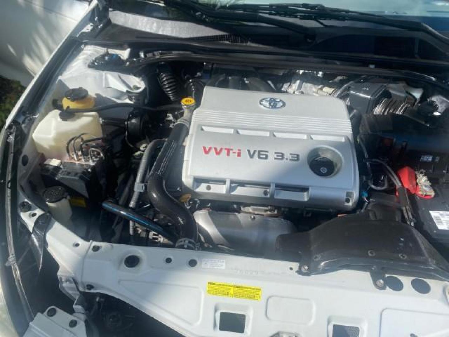 2007 Blizzard Pearl /Ivory Toyota Camry Solara SLE LOW MILES 59,911 SOFT TOP (4T1FA38P07U) with an 3.3L DOHC SMPI VVT-i 24-Valve V6 Engine engine, Automatic transmission, located at 4701 North Dixie Hwy, Pompano Beach, FL, 33064, (954) 422-2889, 26.240938, -80.123474 - OUR WEBPAGE FLORIDACARS1.COM HAS OVER 100 PHOTOS AND FREE CARFAX LINK 2007 TOYOTA CAMRY SOLARA SLE V6 VIN: 4T1FA38P07U119420 4 T 1 F A 3 8 P 0 7 U 1 1 9 4 2 0 CONVERTIBLE 3.3L V6 F DOHC 24V GASOLINE 29 MPG FRONT WHEEL DRIVE Features ABS Brakes Air Conditioning Alloy Wheels AM/FM Stereo Automatic Tra - Photo#24