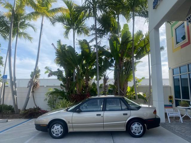 1995 Gold /Tan Saturn SL LOW MILES 70,805 (1G8ZH5282SZ) with an 1.9L 4-Cyl Engine engine, Automatic transmission, located at 4701 North Dixie Hwy, Pompano Beach, FL, 33064, (954) 422-2889, 26.240938, -80.123474 - OUR WEBPAGE FLORIDACARS1.COM HAS OVER 100 PHOTOS AND FREE CARFAX LINK 1995 SATURN S-SERIES SL1 ONE OF A KIND FIND DRIVES AMAZING VERY DEPENDABLE VIN: 1G8ZH5282SZ152130 1 G 8 Z H 5 2 8 2 S Z 1 5 2 1 3 0 SEDAN 4 DR 1.9L I4 F SOHC GASOLINE FRONT WHEEL DRIVE Features Air Conditioning AM/FM Stereo Automa - Photo#4