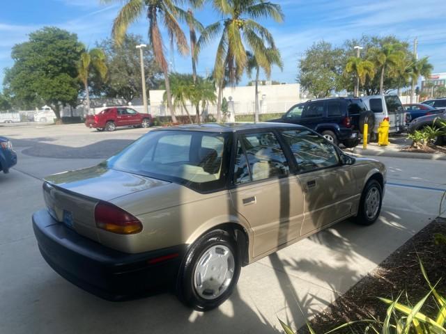 1995 Gold /Tan Saturn SL LOW MILES 70,805 (1G8ZH5282SZ) with an 1.9L 4-Cyl Engine engine, Automatic transmission, located at 4701 North Dixie Hwy, Pompano Beach, FL, 33064, (954) 422-2889, 26.240938, -80.123474 - OUR WEBPAGE FLORIDACARS1.COM HAS OVER 100 PHOTOS AND FREE CARFAX LINK 1995 SATURN S-SERIES SL1 ONE OF A KIND FIND DRIVES AMAZING VERY DEPENDABLE VIN: 1G8ZH5282SZ152130 1 G 8 Z H 5 2 8 2 S Z 1 5 2 1 3 0 SEDAN 4 DR 1.9L I4 F SOHC GASOLINE FRONT WHEEL DRIVE Features Air Conditioning AM/FM Stereo Automa - Photo#7