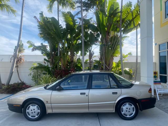 1995 Gold /Tan Saturn SL LOW MILES 70,805 (1G8ZH5282SZ) with an 1.9L 4-Cyl Engine engine, Automatic transmission, located at 4701 North Dixie Hwy, Pompano Beach, FL, 33064, (954) 422-2889, 26.240938, -80.123474 - OUR WEBPAGE FLORIDACARS1.COM HAS OVER 100 PHOTOS AND FREE CARFAX LINK 1995 SATURN S-SERIES SL1 ONE OF A KIND FIND DRIVES AMAZING VERY DEPENDABLE VIN: 1G8ZH5282SZ152130 1 G 8 Z H 5 2 8 2 S Z 1 5 2 1 3 0 SEDAN 4 DR 1.9L I4 F SOHC GASOLINE FRONT WHEEL DRIVE Features Air Conditioning AM/FM Stereo Automa - Photo#32