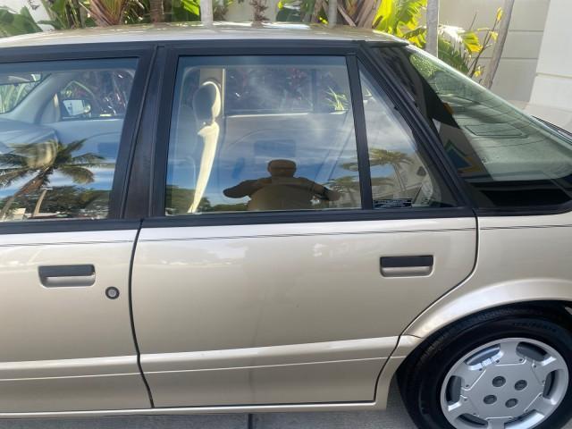 1995 Gold /Tan Saturn SL LOW MILES 70,805 (1G8ZH5282SZ) with an 1.9L 4-Cyl Engine engine, Automatic transmission, located at 4701 North Dixie Hwy, Pompano Beach, FL, 33064, (954) 422-2889, 26.240938, -80.123474 - OUR WEBPAGE FLORIDACARS1.COM HAS OVER 100 PHOTOS AND FREE CARFAX LINK 1995 SATURN S-SERIES SL1 ONE OF A KIND FIND DRIVES AMAZING VERY DEPENDABLE VIN: 1G8ZH5282SZ152130 1 G 8 Z H 5 2 8 2 S Z 1 5 2 1 3 0 SEDAN 4 DR 1.9L I4 F SOHC GASOLINE FRONT WHEEL DRIVE Features Air Conditioning AM/FM Stereo Automa - Photo#69