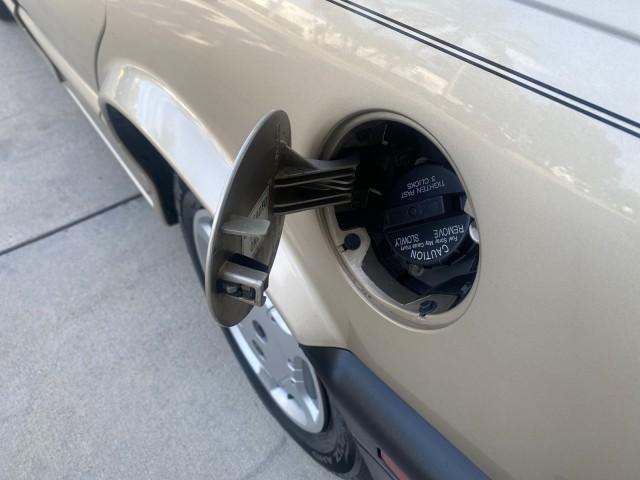 1995 Gold /Tan Saturn SL LOW MILES 70,805 (1G8ZH5282SZ) with an 1.9L 4-Cyl Engine engine, Automatic transmission, located at 4701 North Dixie Hwy, Pompano Beach, FL, 33064, (954) 422-2889, 26.240938, -80.123474 - OUR WEBPAGE FLORIDACARS1.COM HAS OVER 100 PHOTOS AND FREE CARFAX LINK 1995 SATURN S-SERIES SL1 ONE OF A KIND FIND DRIVES AMAZING VERY DEPENDABLE VIN: 1G8ZH5282SZ152130 1 G 8 Z H 5 2 8 2 S Z 1 5 2 1 3 0 SEDAN 4 DR 1.9L I4 F SOHC GASOLINE FRONT WHEEL DRIVE Features Air Conditioning AM/FM Stereo Automa - Photo#83