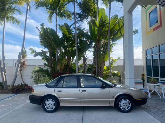 1995 Gold /Tan Saturn SL LOW MILES 70,805 (1G8ZH5282SZ) with an 1.9L 4-Cyl Engine engine, Automatic transmission, located at 4701 North Dixie Hwy, Pompano Beach, FL, 33064, (954) 422-2889, 26.240938, -80.123474 - OUR WEBPAGE FLORIDACARS1.COM HAS OVER 100 PHOTOS AND FREE CARFAX LINK 1995 SATURN S-SERIES SL1 ONE OF A KIND FIND DRIVES AMAZING VERY DEPENDABLE VIN: 1G8ZH5282SZ152130 1 G 8 Z H 5 2 8 2 S Z 1 5 2 1 3 0 SEDAN 4 DR 1.9L I4 F SOHC GASOLINE FRONT WHEEL DRIVE Features Air Conditioning AM/FM Stereo Automa - Photo#94