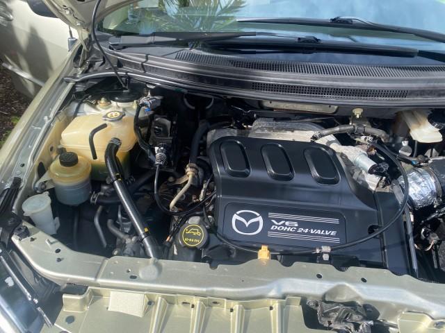 2004 Cosmic Sand Metallic /Beige/Black Mazda MPV LX LOW MILES 62,740 (JM3LW28J340) with an 3.0L DOHC MPFI 24-Valve V6 Engine engine, Automatic transmission, located at 4701 North Dixie Hwy, Pompano Beach, FL, 33064, (954) 422-2889, 26.240938, -80.123474 - OUR WEBPAGE FLORIDACARS1.COM HAS OVER 100 PHOTOS AND FREE CARFAX LINK 2004 MAZDA MPV LX VIN: JM3LW28J340519237 J M 3 L W 2 8 J 3 4 0 5 1 9 2 3 7 VAN 3.0L V6 F GASOLINE 25 MPG FRONT WHEEL DRIVE Features ABS Brakes Air Conditioning Alloy Wheels AM/FM Stereo Automatic Transmission CD Audio Cloth Seats - Photo#25