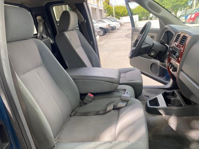 2005 Atlantic Blue Pearl /Med Slate Gray Dodge Dakota SLT LOW MILES 69,842 4WD CLUB (1D7HW42KX5S) with an 3.7L V6 Magnum Engine engine, Automatic transmission, located at 4701 North Dixie Hwy, Pompano Beach, FL, 33064, (954) 422-2889, 26.240938, -80.123474 - OUR WEBPAGE FLORIDACARS1.COM HAS OVER 100 PHOTOS AND FREE CARFAX LINK 2005 DODGE DAKOTA SLT VIN: 1D7HW42KX5S305983 1 D 7 H W 4 2 K X 5 S 3 0 5 9 8 3 CLUB CAB PICKUP 3.7L V6 F GASOLINE 20 MPG REAR WHEEL DRIVE W/ 4X4 Features 4WD/AWD ABS Brakes Air Conditioning Alloy Wheels AM/FM Stereo Automatic Tran - Photo#12