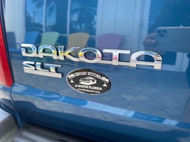 2005 Atlantic Blue Pearl /Med Slate Gray Dodge Dakota SLT LOW MILES 69,842 4WD CLUB (1D7HW42KX5S) with an 3.7L V6 Magnum Engine engine, Automatic transmission, located at 4701 North Dixie Hwy, Pompano Beach, FL, 33064, (954) 422-2889, 26.240938, -80.123474 - OUR WEBPAGE FLORIDACARS1.COM HAS OVER 100 PHOTOS AND FREE CARFAX LINK 2005 DODGE DAKOTA SLT VIN: 1D7HW42KX5S305983 1 D 7 H W 4 2 K X 5 S 3 0 5 9 8 3 CLUB CAB PICKUP 3.7L V6 F GASOLINE 20 MPG REAR WHEEL DRIVE W/ 4X4 Features 4WD/AWD ABS Brakes Air Conditioning Alloy Wheels AM/FM Stereo Automatic Tran - Photo#92