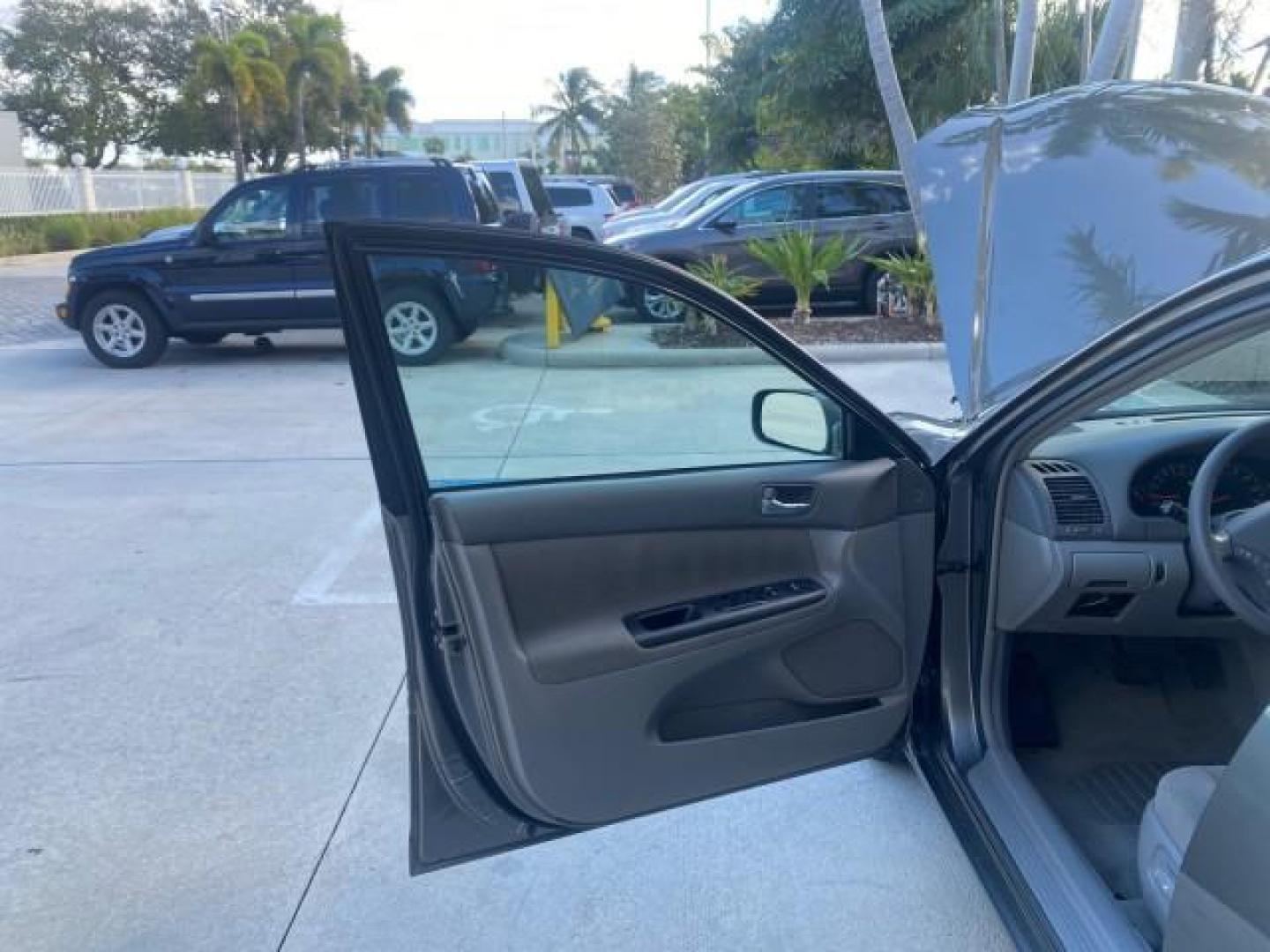 2005 Phantom Gray Pearl /Stone Toyota Camry XLE LOW MILES 68,563 1 OWNER (4T1BF30K05U) with an 3.0L DOHC MPFI Vvti 24-Valve V6 Engine engine, Automatic transmission, located at 4701 North Dixie Hwy, Pompano Beach, FL, 33064, (954) 422-2889, 26.240938, -80.123474 - OUR WEBPAGE FLORIDACARS1.COM HAS OVER 100 PHOTOS AND FREE CARFAX LINK 2005 TOYOTA CAMRY XLE V6 1 OWNER VIN: 4T1BF30K05U621308 4 T 1 B F 3 0 K 0 5 U 6 2 1 3 0 8 SEDAN 4 DR 3.0L V6 F DOHC 24V GASOLINE 28 MPG FRONT WHEEL DRIVE Features ABS Brakes Air Conditioning Alloy Wheels AM/FM Stereo Automatic Tra - Photo#9