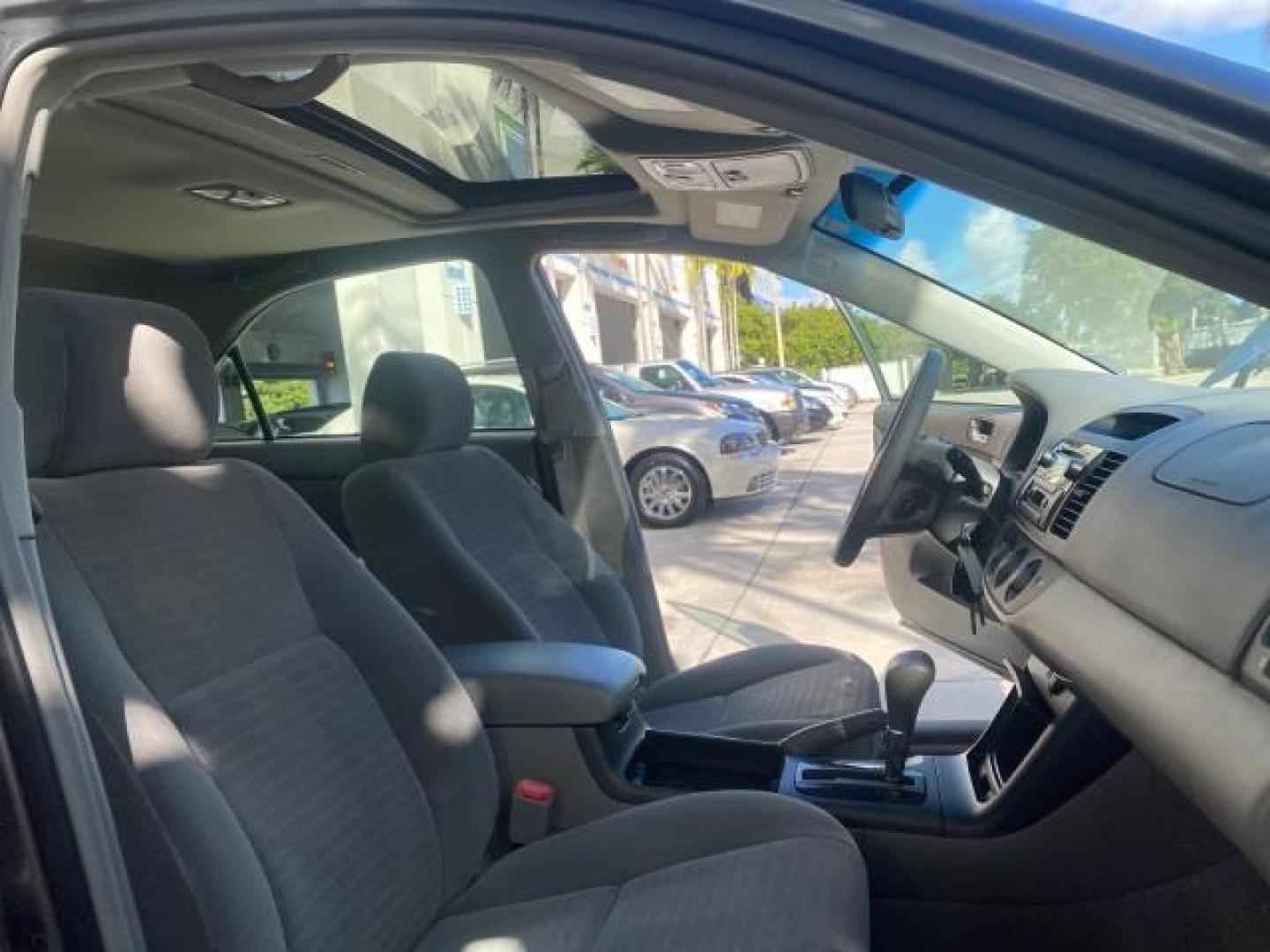 2005 Phantom Gray Pearl /Stone Toyota Camry XLE LOW MILES 68,563 1 OWNER (4T1BF30K05U) with an 3.0L DOHC MPFI Vvti 24-Valve V6 Engine engine, Automatic transmission, located at 4701 North Dixie Hwy, Pompano Beach, FL, 33064, (954) 422-2889, 26.240938, -80.123474 - OUR WEBPAGE FLORIDACARS1.COM HAS OVER 100 PHOTOS AND FREE CARFAX LINK 2005 TOYOTA CAMRY XLE V6 1 OWNER VIN: 4T1BF30K05U621308 4 T 1 B F 3 0 K 0 5 U 6 2 1 3 0 8 SEDAN 4 DR 3.0L V6 F DOHC 24V GASOLINE 28 MPG FRONT WHEEL DRIVE Features ABS Brakes Air Conditioning Alloy Wheels AM/FM Stereo Automatic Tra - Photo#12