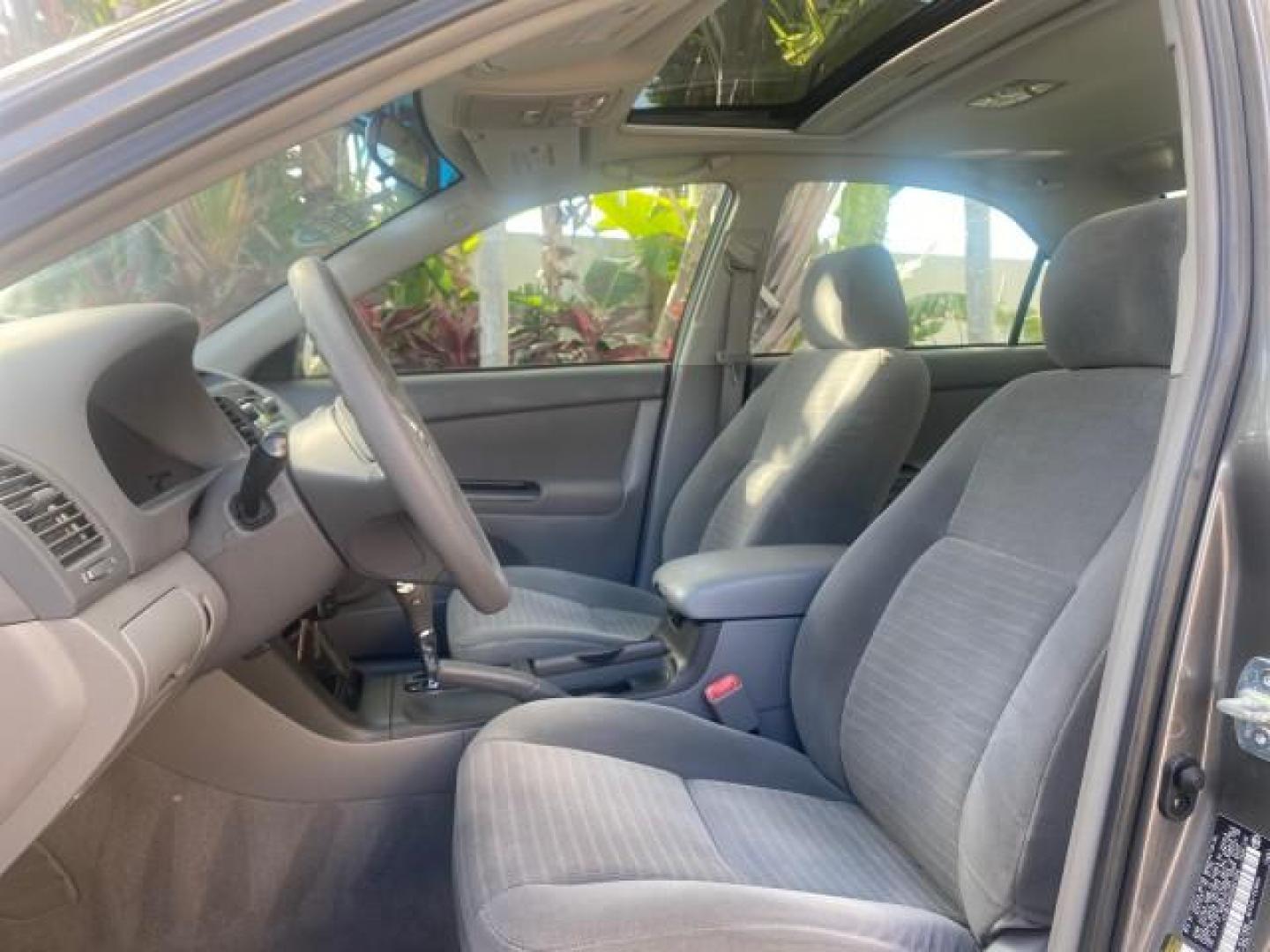 2005 Phantom Gray Pearl /Stone Toyota Camry XLE LOW MILES 68,563 1 OWNER (4T1BF30K05U) with an 3.0L DOHC MPFI Vvti 24-Valve V6 Engine engine, Automatic transmission, located at 4701 North Dixie Hwy, Pompano Beach, FL, 33064, (954) 422-2889, 26.240938, -80.123474 - OUR WEBPAGE FLORIDACARS1.COM HAS OVER 100 PHOTOS AND FREE CARFAX LINK 2005 TOYOTA CAMRY XLE V6 1 OWNER VIN: 4T1BF30K05U621308 4 T 1 B F 3 0 K 0 5 U 6 2 1 3 0 8 SEDAN 4 DR 3.0L V6 F DOHC 24V GASOLINE 28 MPG FRONT WHEEL DRIVE Features ABS Brakes Air Conditioning Alloy Wheels AM/FM Stereo Automatic Tra - Photo#42