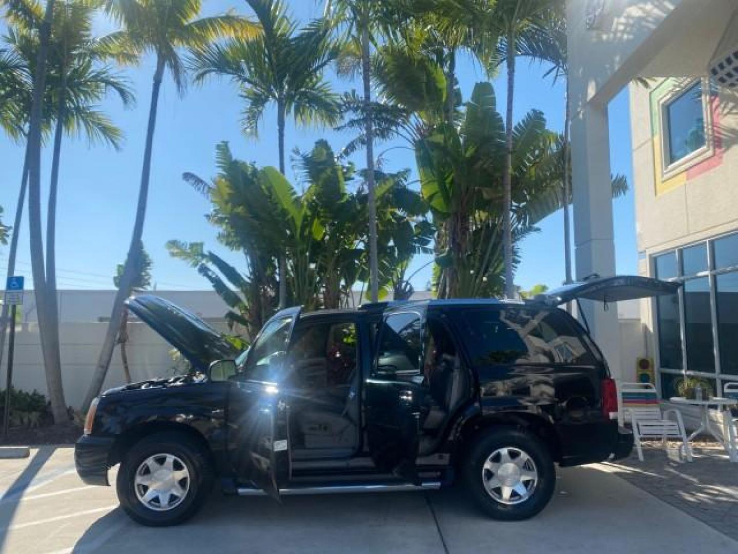 2002 Sable Black /Pewter Cadillac Escalade L0W MILES 68,090 4WD (1GYEK63N92R) with an 6.0L Vortec 1000 SFI V8 HO Engine engine, Automatic transmission, located at 4701 North Dixie Hwy, Pompano Beach, FL, 33064, (954) 422-2889, 26.240938, -80.123474 - OUR WEBPAGE FLORIDACARS1.COM HAS OVER 100 PHOTOS AND FREE CARFAX LINK 2002 CADILLAC ESCALADE 4WD COST 52,230 NEW ALL ORIGINAL BLACK PAINT VIN: 1GYEK63N92R116865 1 G Y E K 6 3 N 9 2 R 1 1 6 8 6 5 4 DOOR WAGON/SPORT UTILITY 6.0L V8 F GASOLINE 17 MPG ALL WHEEL DRIVE Features 4WD/AWD ABS Brakes Air Cond - Photo#8