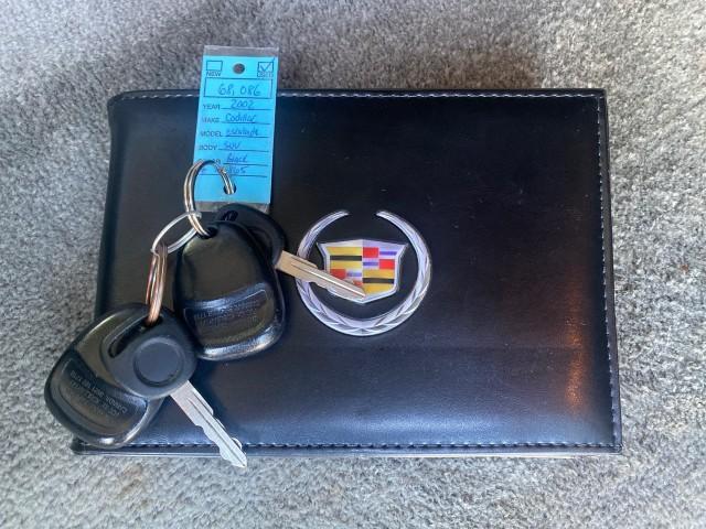 2002 Sable Black /Pewter Cadillac Escalade L0W MILES 68,090 4WD (1GYEK63N92R) with an 6.0L Vortec 1000 SFI V8 HO Engine engine, Automatic transmission, located at 4701 North Dixie Hwy, Pompano Beach, FL, 33064, (954) 422-2889, 26.240938, -80.123474 - OUR WEBPAGE FLORIDACARS1.COM HAS OVER 100 PHOTOS AND FREE CARFAX LINK 2002 CADILLAC ESCALADE 4WD COST 52,230 NEW ALL ORIGINAL BLACK PAINT VIN: 1GYEK63N92R116865 1 G Y E K 6 3 N 9 2 R 1 1 6 8 6 5 4 DOOR WAGON/SPORT UTILITY 6.0L V8 F GASOLINE 17 MPG ALL WHEEL DRIVE Features 4WD/AWD ABS Brakes Air Cond - Photo#23