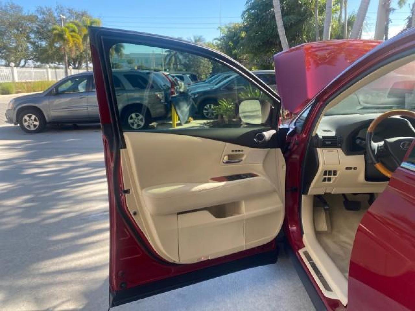 2012 Matador Red Mica /Parchment Lexus RX 350 LOW MILES 68,785 1 OWNER NAV SUV (2T2ZK1BA6CC) with an 3.5L DOHC SFI 24-Valve V6 Engine engine, Automatic transmission, located at 4701 North Dixie Hwy, Pompano Beach, FL, 33064, (954) 422-2889, 26.240938, -80.123474 - OUR WEBPAGE FLORIDACARS1.COM HAS OVER 100 PHOTOS AND FREE CARFAX LINK 2012 LEXUS RX 350 1 OWNER SUNROOF NAVIGATION LOADED VIN: 2T2ZK1BA6CC065213 2 T 2 Z K 1 B A 6 C C 0 6 5 2 1 3 4 DOOR WAGON/SPORT UTILITY 3.5L V6 F DOHC 24V GASOLINE 25 MPG FRONT WHEEL DRIVE Features A/C Seat(s) ABS Brakes Air Condi - Photo#9
