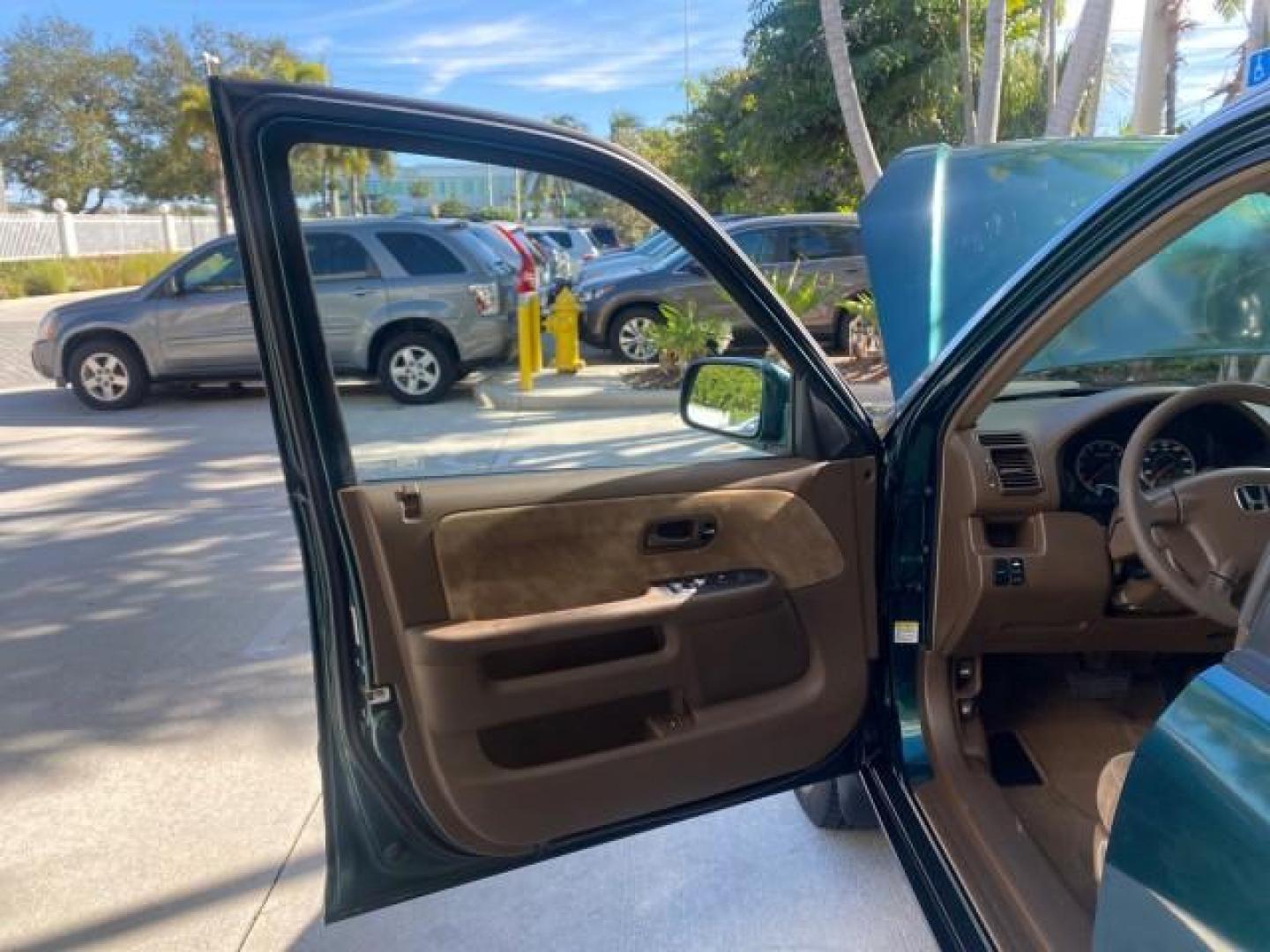 2002 Clover Green Pearl /Saddle Honda CR-V EX LOW MILES 34,271 1 OWNER 4WD (JHLRD78812C) with an 2.4L DOHC i-VTEC 16-Valve I4 Engine engine, Automatic transmission, located at 4701 North Dixie Hwy, Pompano Beach, FL, 33064, (954) 422-2889, 26.240938, -80.123474 - OUR WEBPAGE FLORIDACARS1.COM HAS OVER 100 PHOTOS AND FREE CARFAX LINK 2002 HONDA CR-V EX 4WD 1 OWNER VIN: JHLRD78812C081089 J H L R D 7 8 8 1 2 C 0 8 1 0 8 9 4 DOOR WAGON/SPORT UTILITY 2.4L I4 F DOHC GASOLINE 26 MPG ALL WHEEL DRIVE Features 4WD/AWD ABS Brakes Air Conditioning Alloy Wheels AM/FM Ster - Photo#9
