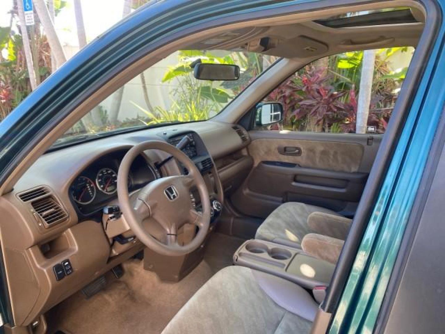 2002 Clover Green Pearl /Saddle Honda CR-V EX LOW MILES 34,271 1 OWNER 4WD (JHLRD78812C) with an 2.4L DOHC i-VTEC 16-Valve I4 Engine engine, Automatic transmission, located at 4701 North Dixie Hwy, Pompano Beach, FL, 33064, (954) 422-2889, 26.240938, -80.123474 - OUR WEBPAGE FLORIDACARS1.COM HAS OVER 100 PHOTOS AND FREE CARFAX LINK 2002 HONDA CR-V EX 4WD 1 OWNER VIN: JHLRD78812C081089 J H L R D 7 8 8 1 2 C 0 8 1 0 8 9 4 DOOR WAGON/SPORT UTILITY 2.4L I4 F DOHC GASOLINE 26 MPG ALL WHEEL DRIVE Features 4WD/AWD ABS Brakes Air Conditioning Alloy Wheels AM/FM Ster - Photo#44