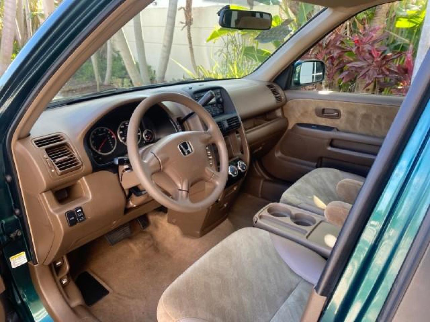 2002 Clover Green Pearl /Saddle Honda CR-V EX LOW MILES 34,271 1 OWNER 4WD (JHLRD78812C) with an 2.4L DOHC i-VTEC 16-Valve I4 Engine engine, Automatic transmission, located at 4701 North Dixie Hwy, Pompano Beach, FL, 33064, (954) 422-2889, 26.240938, -80.123474 - OUR WEBPAGE FLORIDACARS1.COM HAS OVER 100 PHOTOS AND FREE CARFAX LINK 2002 HONDA CR-V EX 4WD 1 OWNER VIN: JHLRD78812C081089 J H L R D 7 8 8 1 2 C 0 8 1 0 8 9 4 DOOR WAGON/SPORT UTILITY 2.4L I4 F DOHC GASOLINE 26 MPG ALL WHEEL DRIVE Features 4WD/AWD ABS Brakes Air Conditioning Alloy Wheels AM/FM Ster - Photo#45